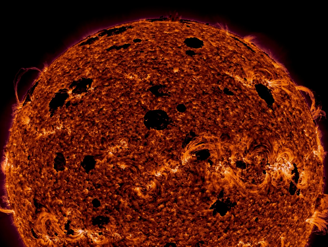 High-resolution solar surface detail showing sunspots and magnetic filaments